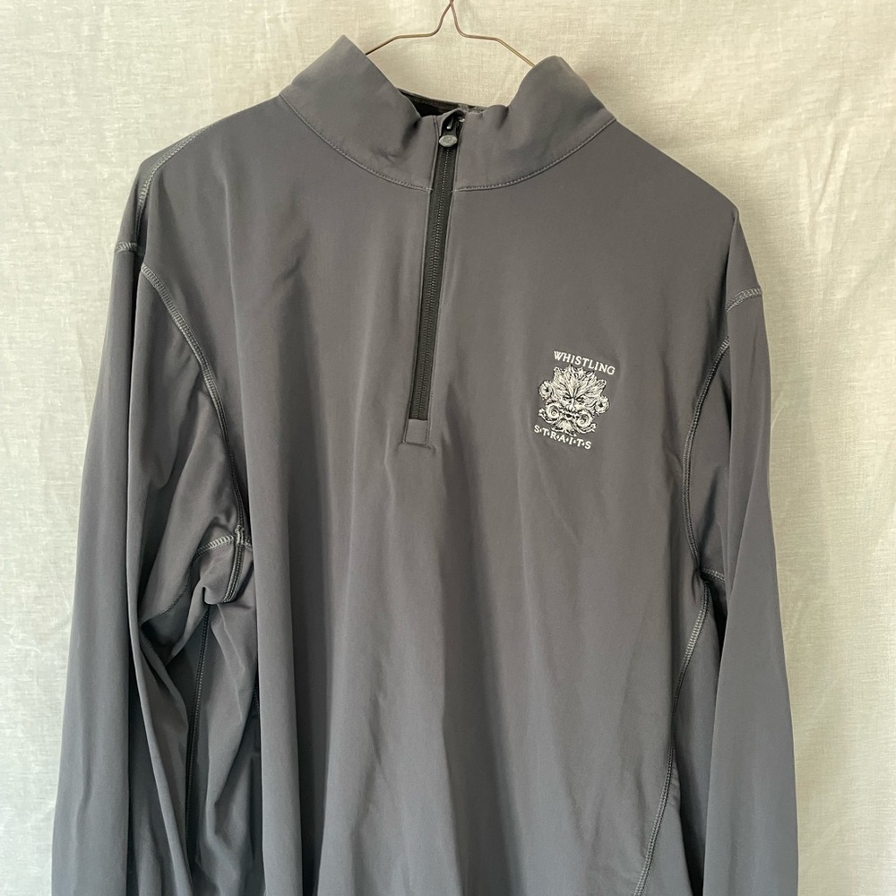 Three quarter zip long sleeve shirt w/ Whistling Straights golf course logo.